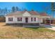 Charming one-story home featuring a carport, white siding, red shutters, and inviting front entry at 2070 Hunters Ridge Rd, Lancaster, SC 29720