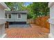 Backyard deck with grey stone tiles, view of the yard, and a fenced perimeter at 2115 Laburnum Ave, Charlotte, NC 28205