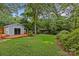 Large backyard boasts a shed with a wooden deck and a spacious lawn at 2115 Laburnum Ave, Charlotte, NC 28205
