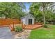Backyard shed with a deck, offering storage and outdoor relaxation at 2115 Laburnum Ave, Charlotte, NC 28205