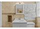 Neutral bathroom featuring a white vanity, mirror, tiled walls, and modular pegboard organizer at 2115 Laburnum Ave, Charlotte, NC 28205