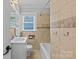 Neutral bathroom featuring shower/tub combination and tile surround at 2115 Laburnum Ave, Charlotte, NC 28205