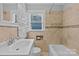 Neutral bathroom featuring shower/tub combination and tile surround at 2115 Laburnum Ave, Charlotte, NC 28205