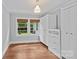 Bedroom featuring hardwood floors, natural light, and built-in storage at 2115 Laburnum Ave, Charlotte, NC 28205