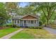 Charming bungalow-style home with well-maintained lawn and landscaped front yard at 2115 Laburnum Ave, Charlotte, NC 28205