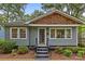 Inviting craftsman-style home with a cozy front porch and manicured landscaping at 2115 Laburnum Ave, Charlotte, NC 28205