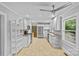 Updated kitchen boasts stainless steel appliances, white cabinets, granite countertops, and modern fixtures at 2115 Laburnum Ave, Charlotte, NC 28205