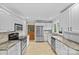 Modern kitchen featuring stainless steel appliances, including a range, microwave and granite countertops at 2115 Laburnum Ave, Charlotte, NC 28205