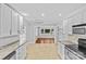 Bright, open kitchen with stainless appliances, granite counters and tile flooring at 2115 Laburnum Ave, Charlotte, NC 28205