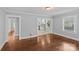Open living space with hardwood floors and views into the kitchen at 2115 Laburnum Ave, Charlotte, NC 28205