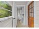 View of the bright mudroom leading to a laundry room and outdoor light at 2115 Laburnum Ave, Charlotte, NC 28205