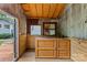 Shed interior with wooden walls, workbench, and outdoor view at 2115 Laburnum Ave, Charlotte, NC 28205