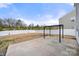 Expansive backyard with a concrete patio and a pergola, perfect for enjoying outdoor activities at 225 Final Stretch Ln, Clover, SC 29710