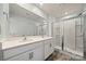 Bathroom featuring a double sink vanity, tile floors and a glass enclosed shower at 225 Final Stretch Ln, Clover, SC 29710