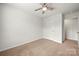 Bedroom with neutral carpet, closet and bathroom access at 225 Final Stretch Ln # 19, Clover, SC 29710