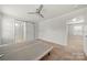 Bedroom featuring a ceiling fan, carpet, and doorway to the bathroom at 225 Final Stretch Ln, Clover, SC 29710