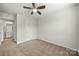Bedroom with neutral carpet, a closet door and a bathroom doorway at 225 Final Stretch Ln, Clover, SC 29710