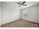 Bedroom with neutral carpet, a window and ceiling fan at 225 Final Stretch Ln, Clover, SC 29710