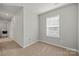 Bedroom features carpet, white trim, and one window at 225 Final Stretch Ln, Clover, SC 29710