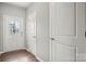 Bright entryway with hardwood floors and a decorative front door, creating a welcoming ambiance at 225 Final Stretch Ln, Clover, SC 29710
