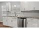 Close up of the kitchen featuring stainless steel appliances, granite countertops and white cabinetry at 225 Final Stretch Ln, Clover, SC 29710