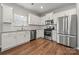 Close up of the kitchen featuring stainless steel appliances and white cabinetry at 225 Final Stretch Ln, Clover, SC 29710