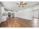 Bright kitchen features stainless steel appliances and white cabinetry. Large living space with hardwood floors at 225 Final Stretch Ln, Clover, SC 29710