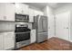 Close up of the kitchen featuring stainless steel appliances and white cabinetry at 225 Final Stretch Ln, Clover, SC 29710