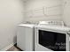 Laundry room with washer, dryer and a wire rack shelf at 225 Final Stretch Ln, Clover, SC 29710