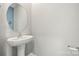 Cozy powder room featuring a pedestal sink, offering convenience for guests at 225 Final Stretch Ln, Clover, SC 29710