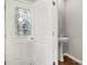 Cozy powder room near the entry featuring a pedestal sink, offering convenience for guests at 225 Final Stretch Ln, Clover, SC 29710