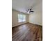 Bright bedroom with large windows, hardwood floors, and neutral paint at 2303 Hope Valley Ln, Charlotte, NC 28213