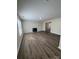 Open living area with hardwood floors, a fireplace, and plenty of natural light at 2303 Hope Valley Ln, Charlotte, NC 28213