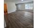 Open-concept living space with beautiful hardwood floors and natural light at 2303 Hope Valley Ln, Charlotte, NC 28213