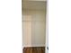 An empty closet with a wire shelf and wood-look flooring at 2307 Hope Valley Ln, Charlotte, NC 28213