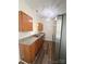 Modern kitchen with stainless steel appliances, granite countertops, and wood-look flooring at 2307 Hope Valley Ln, Charlotte, NC 28213