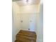 A compact laundry area featuring wood-look flooring, washer-dryer hookups and a wire shelf at 2307 Hope Valley Ln, Charlotte, NC 28213