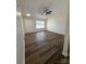 Well-lit living room featuring beautiful wood-look flooring and high ceilings at 2307 Hope Valley Ln, Charlotte, NC 28213