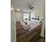 Bright living room with vaulted ceiling, modern furnishings and wood-look flooring at 2307 Hope Valley Ln, Charlotte, NC 28213
