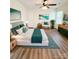 Staged main bedroom with a ceiling fan, decor, and light wood-look floors at 2307 Hope Valley Ln, Charlotte, NC 28213