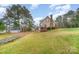 Home exterior features lawn, trees, covered parking, and a glimpse of a porch at 2325 Seymore Ave, Albemarle, NC 28001