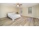 Spacious main bedroom with two windows for natural light and hardwood flooring at 2325 Seymore Ave, Albemarle, NC 28001