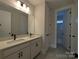 Well-lit bathroom featuring a double sink vanity, modern fixtures, and tile flooring at 251 Luray Way # 441, Rock Hill, SC 29730
