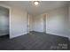 Bright bedroom features neutral walls, carpet, ample closet space, and access to the hallway and ensuite bathroom at 251 Luray Way # 441, Rock Hill, SC 29730