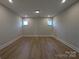 A large bonus room with recessed lighting and two windows offers a flexible space at 251 Luray Way # 441, Rock Hill, SC 29730