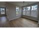 Well lit dining area with lots of windows and hardwood floors at 251 Luray Way # 441, Rock Hill, SC 29730