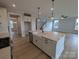 Bright kitchen with island, stainless steel appliances, and a farmhouse sink at 251 Luray Way # 441, Rock Hill, SC 29730
