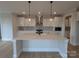 Open kitchen with island, modern pendant lights, and stylish white cabinets at 251 Luray Way # 441, Rock Hill, SC 29730