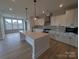 Modern kitchen with a large island, pendant lighting, and stainless steel appliances at 251 Luray Way # 441, Rock Hill, SC 29730