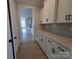 Hallway Pantry featuring long counters, white cabinets, and black hardware at 251 Luray Way # 441, Rock Hill, SC 29730